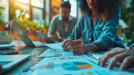 Creative Business Planning Session with Employees Brainstorming Strategies on Whiteboards and Laptops