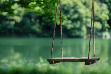 Wooden swing with rope on river background