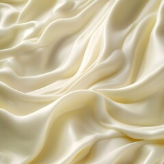 Fototapeta premium A detailed close-up of a soft, creamy beige substance spread across a surface, smooth texture cosmetic product background