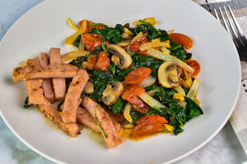 spam fries served with sauteed spinach dish