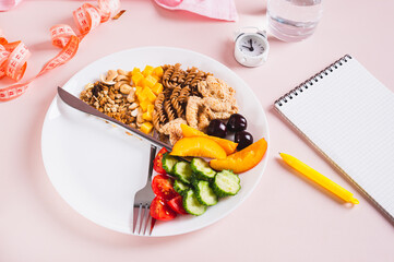 Set of healthy food for individual meal plan on plate on table