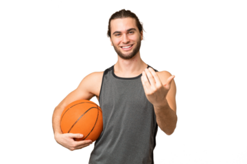 Young handsome man isolated on green chroma background playing basketball and doing coming gesture