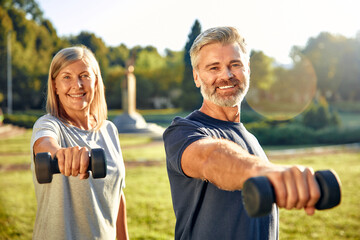 Active seniors are enjoying outdoor fitness activities together, embracing wellness and vitality