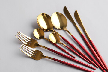 Stylish cutlery on grey background