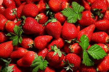 Texture of fresh strawberries with leaves