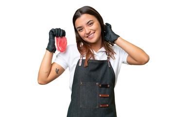 Butcher woman wearing an apron and serving fresh cut meat isolated on green chroma background laughing