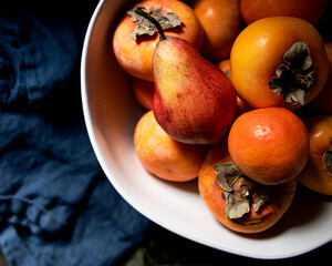 fruit bowl, citrus, pear and persimmons