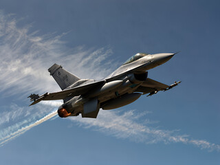 Image of a fighter jet with afterburners burning and motion blur.