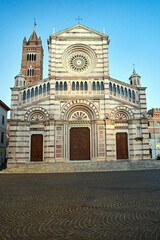Fototapeta premium Facade of the historic cathedral with belfry in the city of Grosseto