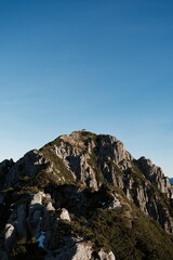 Majestic Rocky Mountain Peak Under Clear Blue Sky (Herzogstand, Germany)