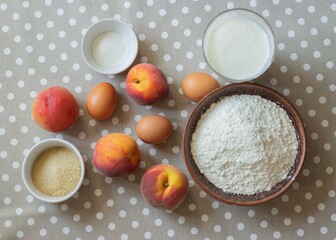 Apricot pie ingredients placed on a dotted tablecloth 