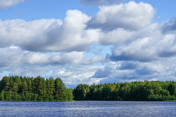 blonde woman at the pier in Rovaniemi Finland in summer time