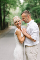 Romantic Couple Embracing in Forest Setting During Daylight, Capturing Love and Affection