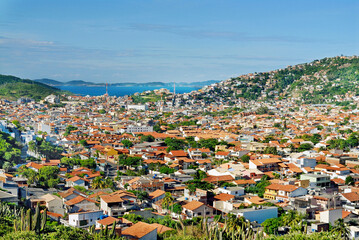Fototapeta premium Houses built at Atalaia Mount, near Angels Beach, in Arraial do Cabo, a tourist city in Rio de Janeiro State. Brazil, 2019.