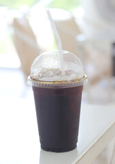 cup of iced coffee on table.