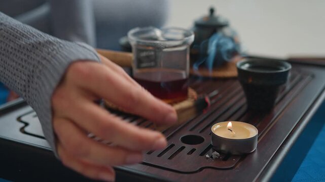 Close up table teapot cup hot tea fragrance meditation rest relax tradition drink liquid pouring beverage recreation aroma tasty herbal healthy wellbeing hands antioxidant drop delicious satisfaction