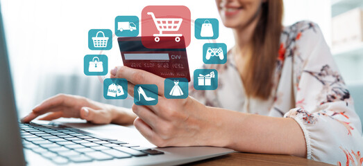 Elegant customer wear white floral shirt holding credit card typing laptop choose online platform. Smart consumer opening e-commerce application use cashless technology shopping inventory. Cybercash.