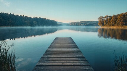 Naklejka premium a wooden dock sitting on top of a lake next to a forest
