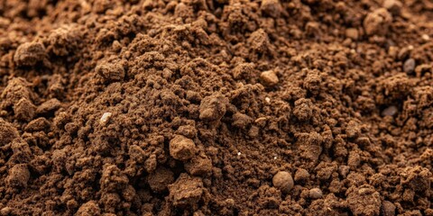 Close-up photo of soil texture background with various shades of brown and natural patterns, soil, texture, background