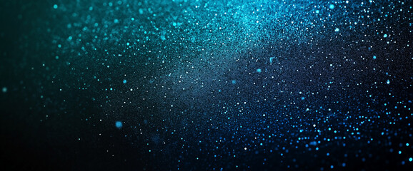 Obraz premium A shimmering blue background filled with sparkling glitter, creating a dazzling and festive visual effect.