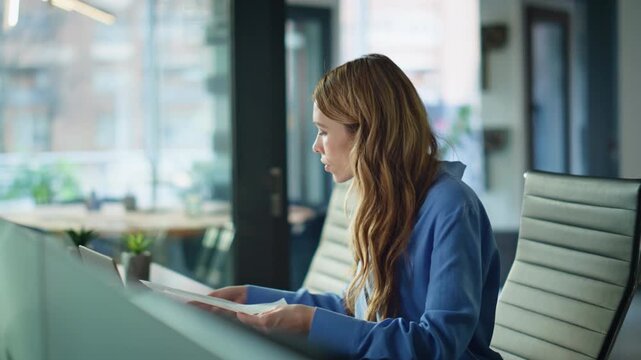 Professional financier examining papers with disappointment at workplace closeup