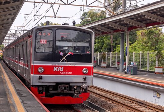 Jakarta, Indonesia - August 10, 2024: The commuter line train stop at the station. Mass public transportation in Jakarta.