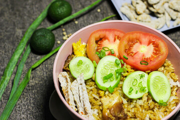 Fried rice or Nasi goreng, traditional frying rice dish from indonesia made of Precooked rice fried in a small amount of oil