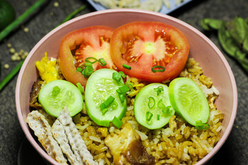 Fried rice or Nasi goreng, traditional frying rice dish from indonesia made of Precooked rice fried in a small amount of oil