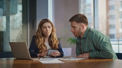 Office mentor learning intern sitting desk with laptop. Confident businesswoman