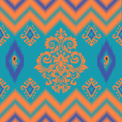 A vivid pattern featuring orange chevron stripes with intricate floral motifs on a turquoise background, accented with blue and orange diamond shapes for a striking visual impact.
