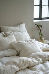 A cozy bedroom scene with a bed featuring white sheets and pillows, accompanied by a vase with fresh flowers