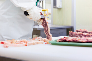 butcher cutting meat