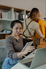 an entrepreneur came to inspect the merchandise in the store where her employees were working on getting the clothing items ready for delivery to customers from the shop