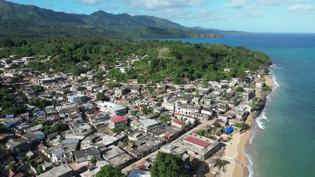 Moh&eacute;li or Mwali, part of the Union of the Comoros, drone fly above small town fisherman village on the coastline on Indian sea ocean water