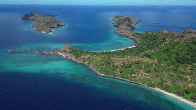 Aerial seascape of Moh&eacute;li or Mwali, part of the Union of the Comoros, blue ocean indian water and scenic rock formation on tropical dreaming island paradise travel destination in Africa