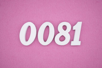 The numbers are made of white painted wood. Laying on the floor was pink paper.