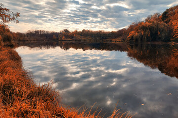Autumn lake on dark background.