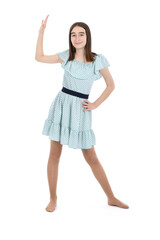 Young beautiful girl in a dress with polka dots on a white background.