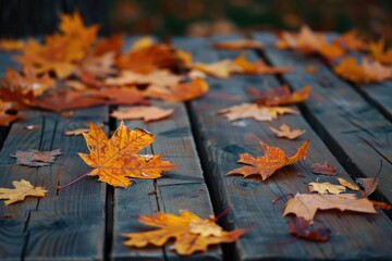 Obraz premium A wooden table covered in vibrant autumn leaves