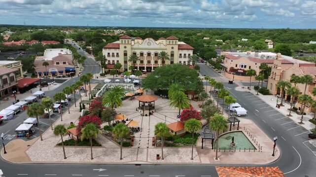 Town Square with palm trees in The Villages City, Florida, USA. Shop and historic buildings in center. Aerial top down shot.