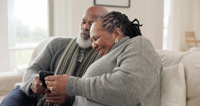 Phone, smile and senior black couple on sofa in home, social media and funny meme. Smartphone, happy elderly man and woman in living room on internet, reading news and laughing together in retirement