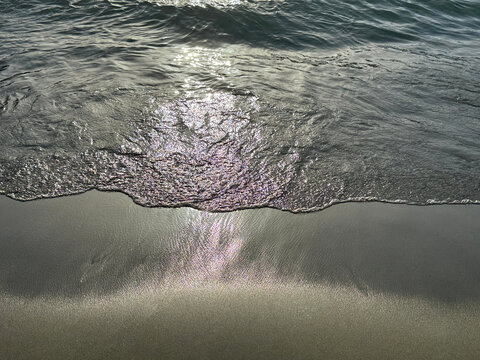 Ocean waves on sand beach. 