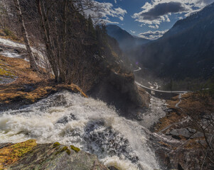 Skjervefossen Waterfall in Spring Landscape