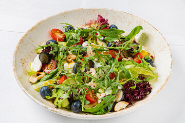 fresh salad with cheese and blueberries