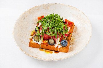 toast with cheese, ham and blueberries