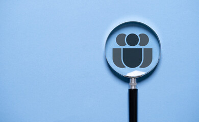 Human icon inside of magnifier glass on blue background for customer focus and Customer relation...