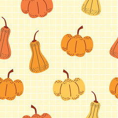 Seamless pattern of pumpkins and squash. Vegetables on light yellow grid background. Autumn harvest design. 