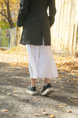 Fototapeta premium Young girl in a white and black clothes.
