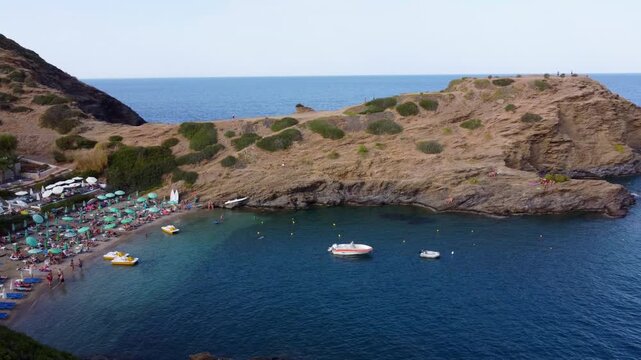 Drone flies sideways over sea in evita bay Bali on Crete in Greece sea is blue and clear a beautiful bay with beach