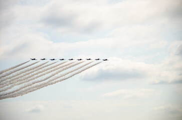 A formation of Nine aircrafts performing display and aerobatics
